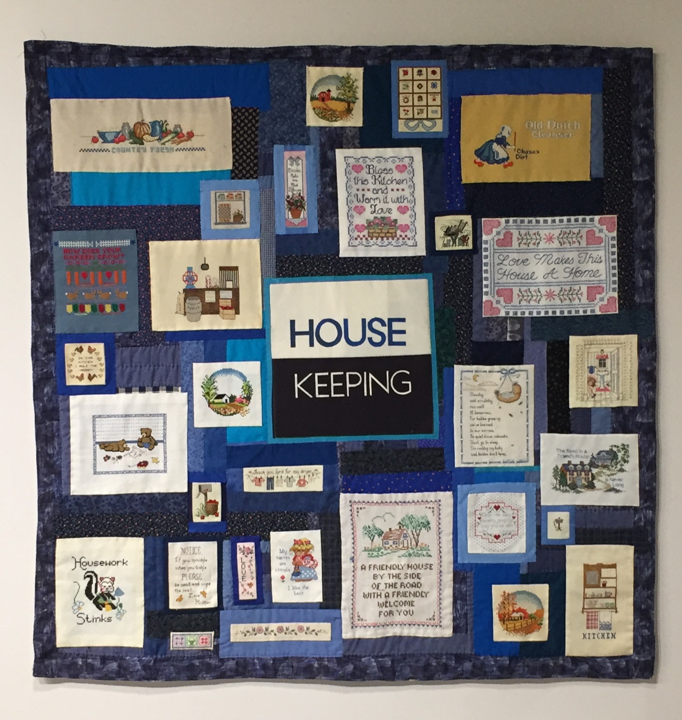 House Keeping, 55" x 55", found cross stitch, recycled materials, table cloth